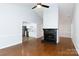Open living space with fireplace and view into kitchen featuring stainless appliances at 1455 Fieldcrest Cir, Rock Hill, SC 29732