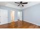 Bright main bedroom featuring hardwood floors and access to bathroom and closet at 1455 Fieldcrest Cir, Rock Hill, SC 29732