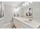 Modern bathroom featuring a long double sink vanity with quartz countertop and marble floors at 1467 Alexander Rd, Rock Hill, SC 29732