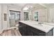 Elegant bathroom featuring a double vanity, large mirror, and glass-enclosed shower with marble tiling at 1467 Alexander Rd, Rock Hill, SC 29732