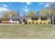 Charming home featuring well-manicured lawn, complemented by colorful shrubs and classic shutters against a bright, sunny sky at 1467 Alexander Rd, Rock Hill, SC 29732