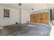 Enclosed garage featuring a white brick wall and natural light coming in at 1467 Alexander Rd, Rock Hill, SC 29732