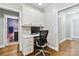Bright and efficient home office with built-in desk and storage, adjacent to a bathroom at 1467 Alexander Rd, Rock Hill, SC 29732