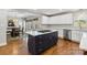 Bright kitchen featuring a large island with cooktop and eat-in area with lovely hardwood floors at 1467 Alexander Rd, Rock Hill, SC 29732