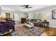 Bright living room featuring hardwood floors, comfortable seating, and an area rug, illuminated by natural light at 1467 Alexander Rd, Rock Hill, SC 29732