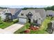 An aerial view of a new construction home showing off the landscaping and a two-car garage at 167 White Apple Way, Statesville, NC 28625