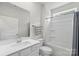 Clean bathroom featuring single sink vanity, toilet, and combination tub and shower at 167 White Apple Way, Statesville, NC 28625