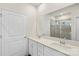 Bright bathroom featuring double sink vanity, large mirror, and glass enclosed shower at 167 White Apple Way, Statesville, NC 28625