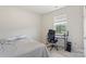 Bedroom featuring neutral walls, carpeted floor, and a computer desk by window at 167 White Apple Way, Statesville, NC 28625
