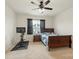 Bedroom includes carpet, ceiling fan, large window, and workout equipment for convenience and comfort at 167 White Apple Way, Statesville, NC 28625