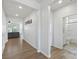 Hallway view with hardwood floors leading to the bathroom and living room at 167 White Apple Way, Statesville, NC 28625