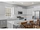 New kitchen featuring white cabinets, stainless appliances, and hardwood floors at 167 White Apple Way, Statesville, NC 28625