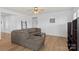 Comfortable living room area featuring wood floors, a sectional sofa, and modern decor at 167 White Apple Way, Statesville, NC 28625