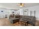 Open-concept living space with a view from the living room into the kitchen with barstool seating at 167 White Apple Way, Statesville, NC 28625