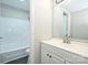 Bright bathroom featuring a tub-shower combo and a white vanity sink at 1931 Mereview Ct # 46, Charlotte, NC 28210