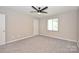 Bright bedroom with a ceiling fan and a window at 1931 Mereview Ct # 46, Charlotte, NC 28210