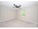 Bedroom with a ceiling fan, gray carpet and window view at 1931 Mereview Ct # 46, Charlotte, NC 28210