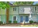 Charming townhome featuring blue doors, light siding, and well-maintained landscaping at 1931 Mereview Ct # 46, Charlotte, NC 28210