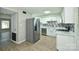 Modern kitchen featuring stainless steel appliances, stylish backsplash, and light wood flooring at 1931 Mereview Ct # 46, Charlotte, NC 28210