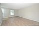 Bright, spacious living room area features vinyl flooring and abundant natural light at 1931 Mereview Ct # 46, Charlotte, NC 28210