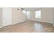 Bright living room with views to staircase and exterior window at 1931 Mereview Ct # 46, Charlotte, NC 28210