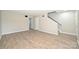 Spacious living room with new floors, neutral walls, and staircase access at 1931 Mereview Ct # 46, Charlotte, NC 28210