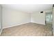 Spacious living room featuring modern floors and neutral paint, creating a bright and inviting space at 1931 Mereview Ct # 46, Charlotte, NC 28210