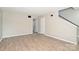 Large living room with view of stairs and a front door with lots of natural light at 1931 Mereview Ct # 46, Charlotte, NC 28210