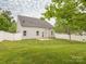 Spacious backyard with a well-maintained lawn and privacy fence at 208 Fielding St, Mount Holly, NC 28120