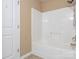 Bathroom showing a bathtub-shower combination with white tiled walls at 208 Fielding St, Mount Holly, NC 28120