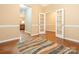 Inviting dining room featuring hardwood floors, natural lighting, and an open doorway to other rooms at 208 Fielding St, Mount Holly, NC 28120
