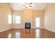 Bright and airy living room with hardwood floors, fireplace, and lots of space at 208 Fielding St, Mount Holly, NC 28120