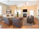 Inviting living room featuring a fireplace, a comfortable seating arrangement, and stylish decor at 208 Fielding St, Mount Holly, NC 28120
