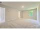 Bedroom featuring carpet, a window providing natural light, and closet at 2107 Columbidae Ln, Gastonia, NC 28052