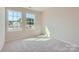 Bedroom featuring carpet and a window providing natural light at 2107 Columbidae Ln, Gastonia, NC 28052