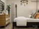 Charming bedroom with modern chandelier, dresser, and closet storage at 2107 Columbidae Ln, Gastonia, NC 28052