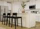 Modern kitchen with stainless steel appliances, a center island, and white cabinets and countertops at 2107 Columbidae Ln, Gastonia, NC 28052