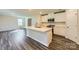 Kitchen featuring a large center island, stainless steel appliances, and white cabinets at 2107 Columbidae Ln, Gastonia, NC 28052