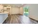 Open-concept living room with hardwood floors, recessed lighting, and sliding glass door at 2107 Columbidae Ln, Gastonia, NC 28052