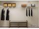 Walk-in closet features built-in shelving with decorative baskets and hanging clothes for optimal storage at 2107 Columbidae Ln, Gastonia, NC 28052