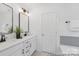 Modern bathroom with double vanity, sleek fixtures, quartz countertops, and stylish tile at 2309 Bulwarks Ct # 4P, Albemarle, NC 28001