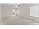 Spacious bedroom with neutral carpet, ceiling fan, and natural light from two windows at 2309 Bulwarks Ct # 4P, Albemarle, NC 28001