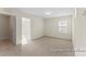Spacious carpeted bedroom with a view into another room through the open doorway at 2309 Bulwarks Ct # 4P, Albemarle, NC 28001
