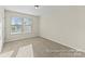 Bright carpeted bedroom with a large window, offering ample natural light at 2309 Bulwarks Ct # 4P, Albemarle, NC 28001