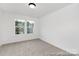 Cozy bedroom with carpeting and windows allowing natural light to illuminate the space at 2309 Bulwarks Ct # 4P, Albemarle, NC 28001