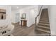 Inviting entryway featuring hardwood flooring, staircase, and stylish decor setting the tone for the home at 2309 Bulwarks Ct # 4P, Albemarle, NC 28001