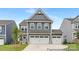 Charming two-story home with a two-car garage, stylish gray siding and manicured lawn at 2309 Bulwarks Ct # 4P, Albemarle, NC 28001