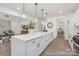 Spacious kitchen with white cabinets, dark hardware, large island and easy access to other living areas at 2309 Bulwarks Ct # 4P, Albemarle, NC 28001