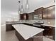 Modern kitchen features a large island, stainless steel appliances, and sleek cabinetry at 2309 Bulwarks Ct # 4P, Albemarle, NC 28001