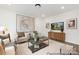 Bright living room featuring modern decor, stylish furniture, and hardwood style floors, perfect for relaxation at 2309 Bulwarks Ct # 4P, Albemarle, NC 28001
